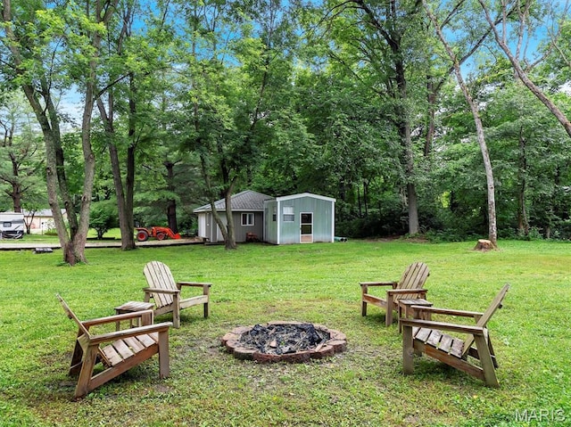 575 E Villa Ridge Rd, Villa Ridge, MO 63089 - view of grassy yard with an outdoor fire pit and an outdoor structure