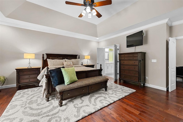 bedroom featuring baseboards, wood finished floors, ornamental molding, connected bathroom, and a ceiling fan