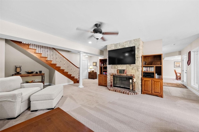 living room with light colored carpet, baseboards, stairway, ceiling fan, and recessed lighting