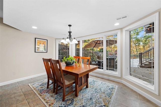 dining space with a chandelier, baseboards, tile patterned flooring, and recessed lighting