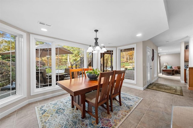 dining area featuring a chandelier, light tile patterned floors, baseboards, and recessed lighting