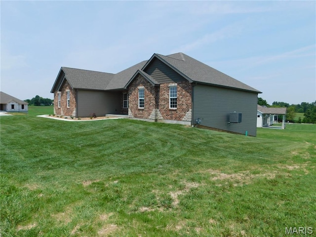 453 Westridge Dr, Troy, MO 63379 - view of home's exterior with brick siding and a yard