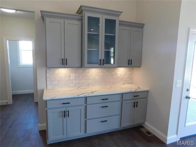 453 Westridge Dr, Troy, MO 63379 - kitchen with gray cabinetry, tasteful backsplash, dark wood-style floors, and glass insert cabinets