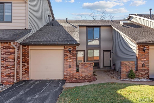 11640 Cedar Walk Dr, Saint Louis, MO 63146 - view of front of property featuring a shingled roof, a garage, brick siding, and asphalt driveway