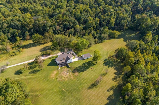 view of property location featuring a forest and rural landscape