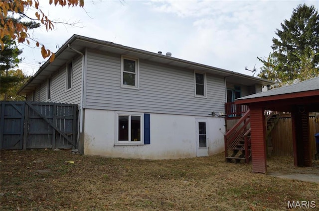 2108 Holland St, Alton, IL 62002 - rear view of property with stairway and a gate