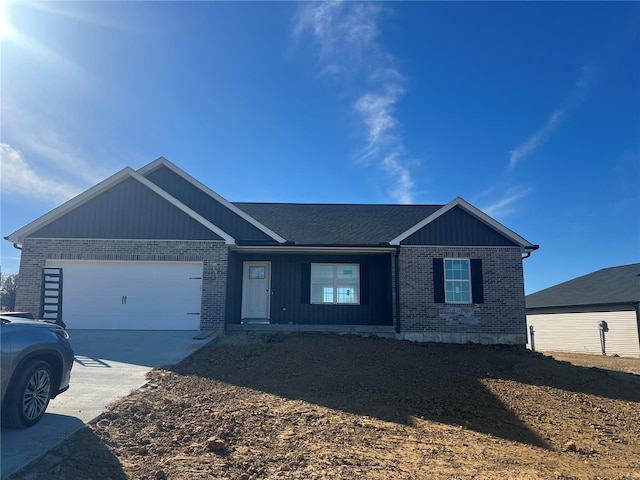 413 Byrd Ct, Jackson, MO 63755 - ranch-style house with brick siding, driveway, and a garage