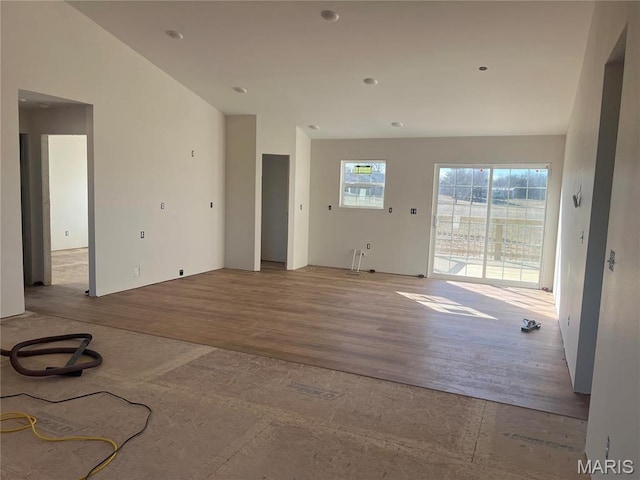 413 Byrd Ct, Jackson, MO 63755 - unfurnished living room featuring wood finished floors and vaulted ceiling