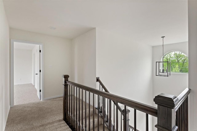 258 Noser Dr, Florissant, MO 63031 - hall with an upstairs landing, carpet, and baseboards