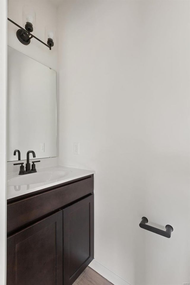 258 Noser Dr, Florissant, MO 63031 - bathroom featuring vanity and wood finished floors