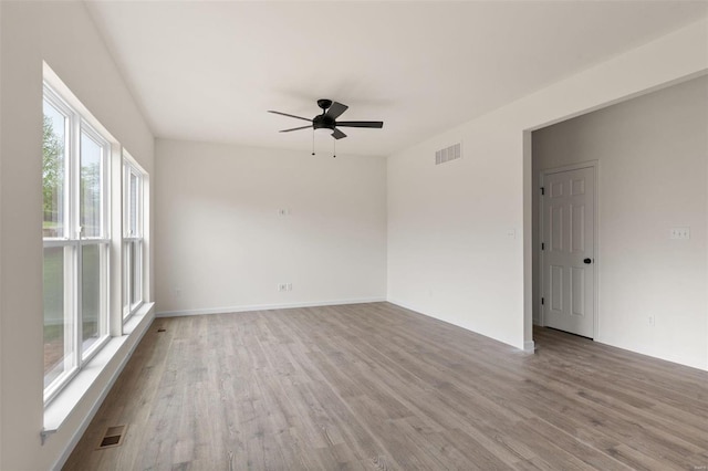 258 Noser Dr, Florissant, MO 63031 - unfurnished room with ceiling fan, wood finished floors, and baseboards