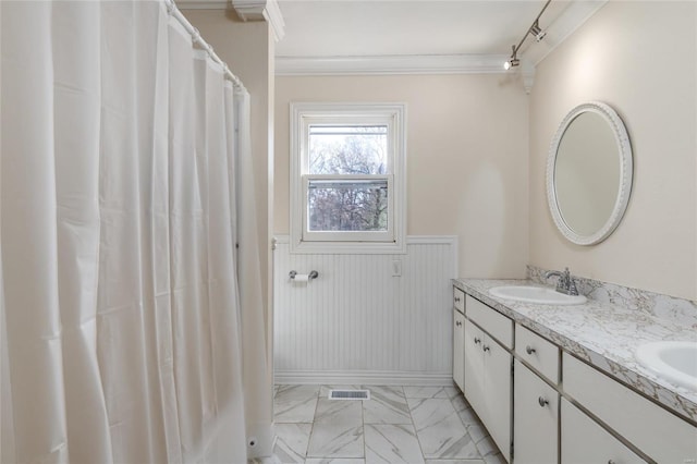 24950 State Rd A, Richland, MO 65556 - bathroom with marble finish floors, ornamental molding, wainscoting, and double vanity