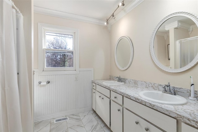 24950 State Rd A, Richland, MO 65556 - bathroom with crown molding, marble look tiles, a wainscoted wall, and double vanity