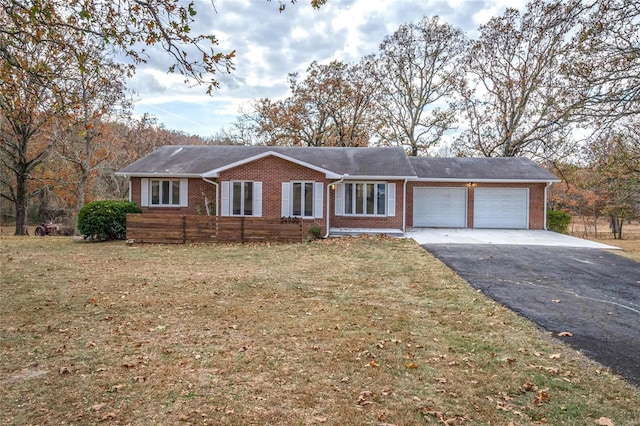 24950 State Rd A, Richland, MO 65556 - ranch-style home featuring brick siding, a garage, driveway, and a front yard