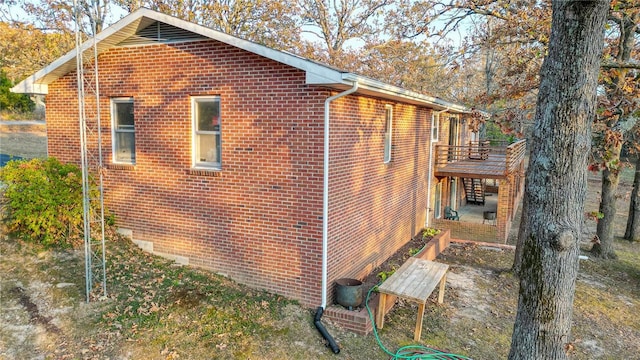 24950 State Rd A, Richland, MO 65556 - view of property exterior with crawl space, a wooden deck, a patio, and brick siding