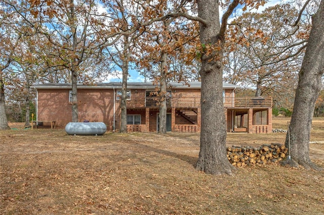 24950 State Rd A, Richland, MO 65556 - rear view of property with a deck and brick siding