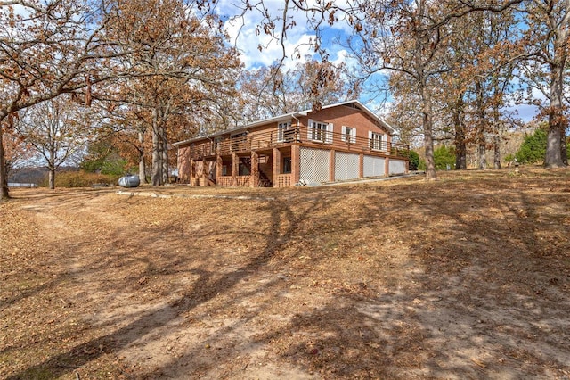 24950 State Rd A, Richland, MO 65556 - view of side of home featuring a wooden deck