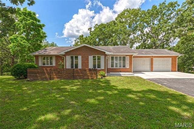 24950 State Rd A, Richland, MO 65556 - ranch-style house featuring a garage, asphalt driveway, brick siding, and a front lawn
