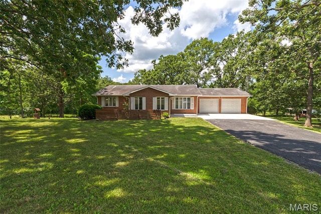 24950 State Rd A, Richland, MO 65556 - single story home featuring an attached garage, driveway, brick siding, and a front lawn