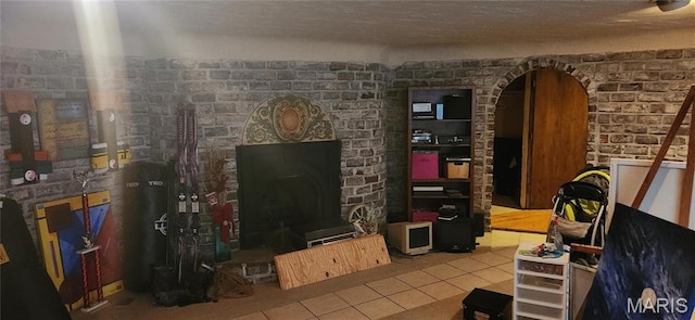 235 Quindaro Dr, Florissant, MO 63034 - living area with tile patterned flooring and a fireplace