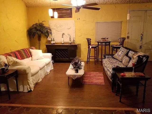235 Quindaro Dr, Florissant, MO 63034 - living area with a textured wall, ceiling fan, and wood finished floors