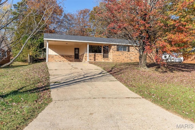 2637 Forest View St, Poplar Bluff, MO 63901 - ranch-style home featuring concrete driveway, a carport, brick siding, and a front yard