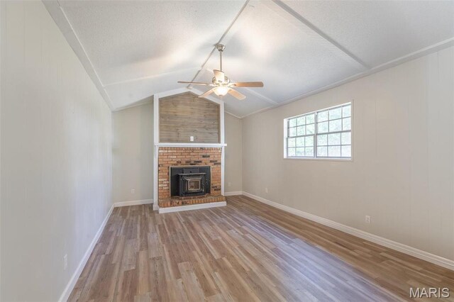 2637 Forest View St, Poplar Bluff, MO 63901 - unfurnished living room with ceiling fan, light wood-style floors, a textured ceiling, baseboards, and lofted ceiling