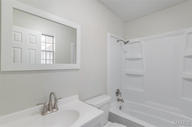 2637 Forest View St, Poplar Bluff, MO 63901 - bathroom featuring toilet, a textured ceiling, bathing tub / shower combination, and vanity
