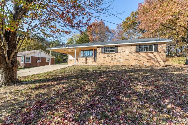 2637 Forest View St, Poplar Bluff, MO 63901 - ranch-style home featuring brick siding, driveway, and a carport