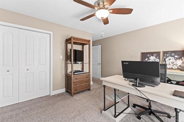 office with light colored carpet, ceiling fan, and baseboards