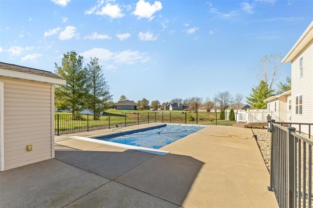 view of pool featuring a patio area and fence