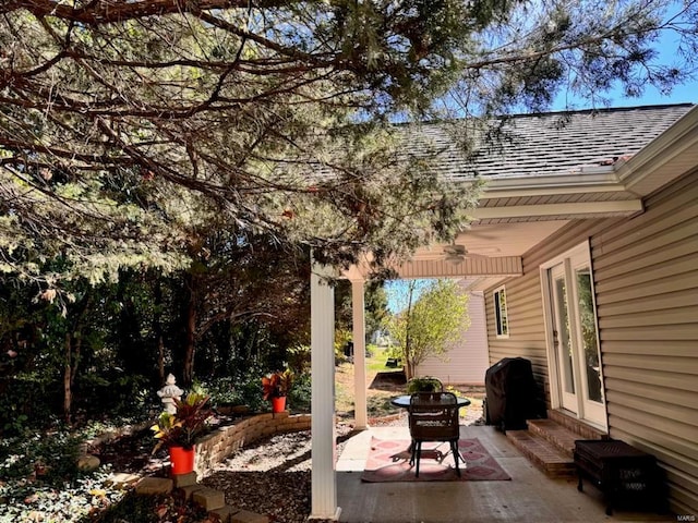 view of patio / terrace with ceiling fan, entry steps, and a grill