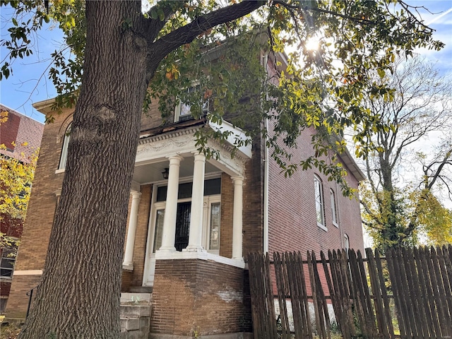 5168 Vernon Ave, Saint Louis, MO 63113 - view of property exterior featuring brick siding and fence