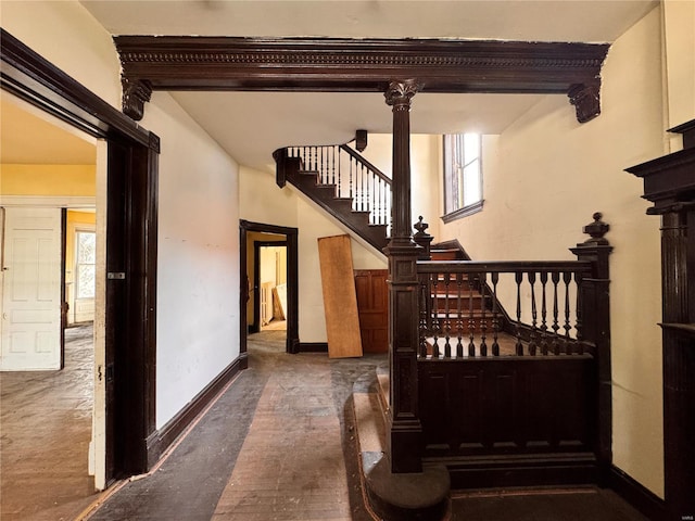 5168 Vernon Ave, Saint Louis, MO 63113 - stairs with healthy amount of natural light, baseboards, and concrete floors