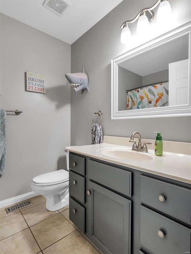 2352 Brookview Dr, Washington, MO 63090 - bathroom with vanity, toilet, tile patterned floors, and baseboards