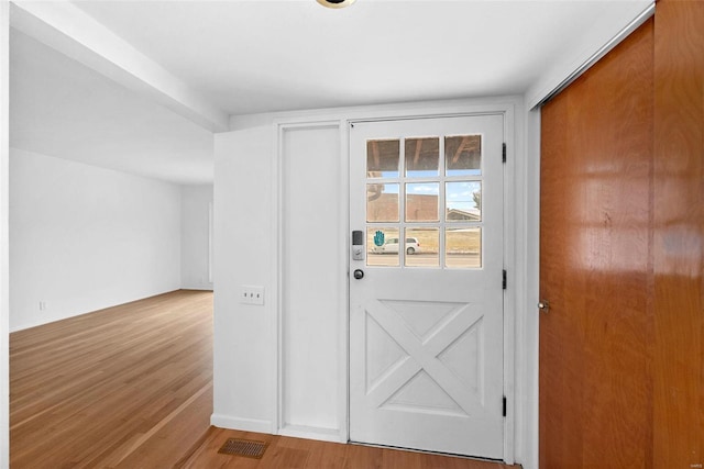 doorway with wood finished floors