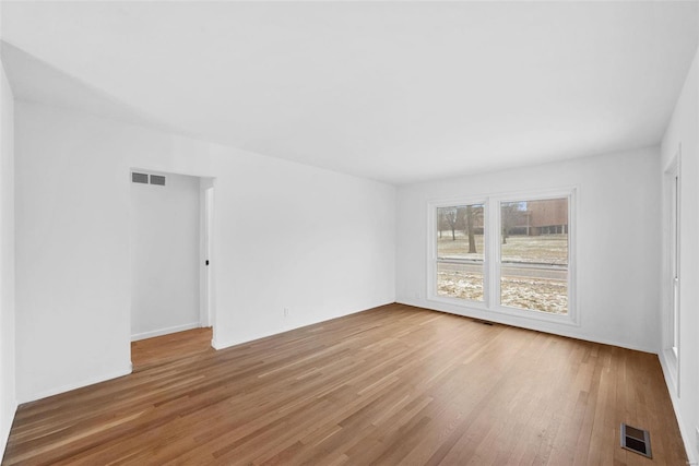 unfurnished room featuring light wood finished floors
