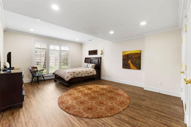 bedroom with wood finished floors, crown molding, baseboards, and recessed lighting