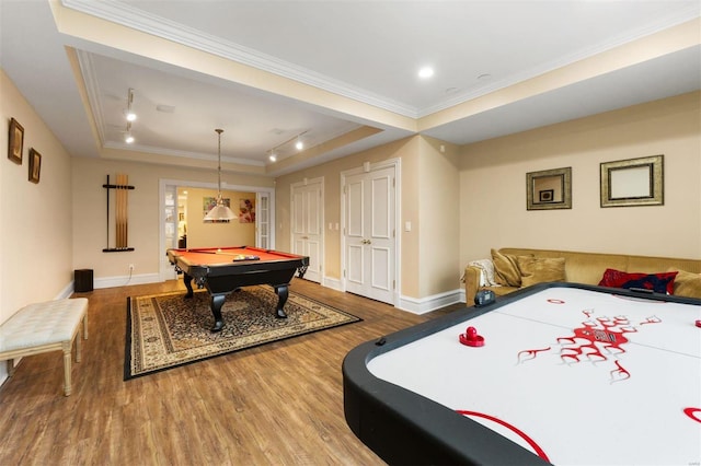 game room featuring a raised ceiling, wood finished floors, billiards, crown molding, and baseboards