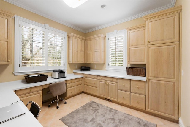 home office featuring built in desk, light tile patterned flooring, and ornamental molding