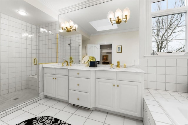 full bathroom featuring a chandelier, crown molding, a stall shower, double vanity, and a skylight