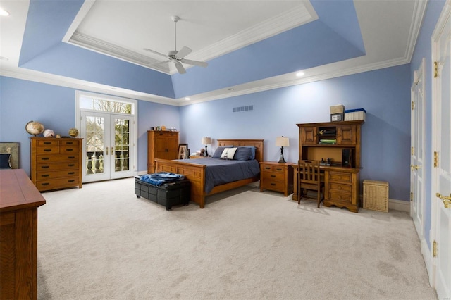 bedroom with carpet flooring, a raised ceiling, access to outside, french doors, and ornamental molding