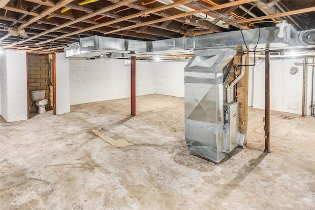 unfinished below grade area featuring heating unit