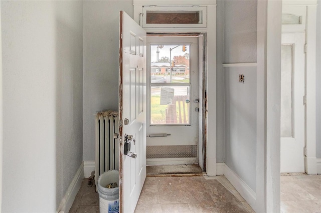 124 Carlyle Ave, Belleville, IL 62220 - doorway featuring radiator and baseboards
