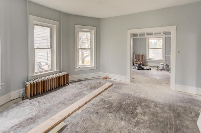 124 Carlyle Ave, Belleville, IL 62220 - empty room featuring radiator heating unit and baseboards