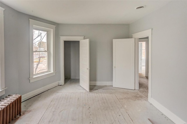 124 Carlyle Ave, Belleville, IL 62220 - unfurnished bedroom featuring radiator and baseboards