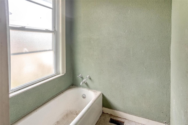 bathroom featuring a bath