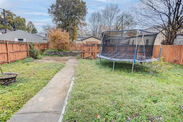 view of yard with a trampoline