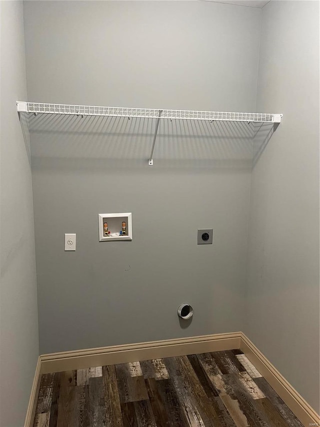 45 Wedgewood Dr, Union, MO 63084 - washroom with hookup for an electric dryer, hookup for a washing machine, wood finished floors, and baseboards
