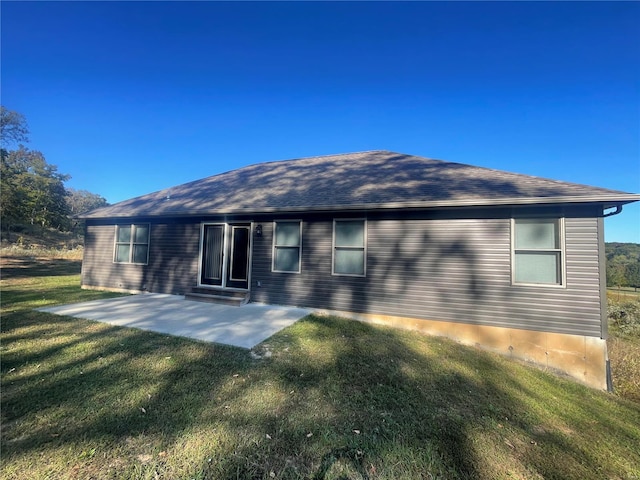45 Wedgewood Dr, Union, MO 63084 - back of house with a yard, a patio area, and roof with shingles